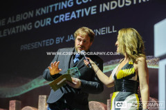 Jamie O’Neill, The Albion Knitting Co with host Juliet Mann. Awards for Excellence 2025. Photo by Callum Staley (CJS Photography)