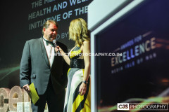 Gary Whipp, Medicann with host Juliet Mann. Awards for Excellence 2025. Photo by Callum Staley (CJS Photography)