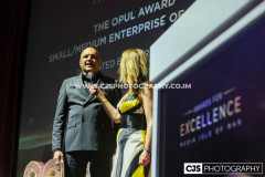 Neeraj Bari, OPUL with host Juliet Mann. Awards for Excellence 2025. Photo by Callum Staley (CJS Photography)