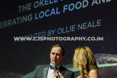Ollie Kneale, Okell’s with host Juliet Mann. Awards for Excellence 2025. Photo by Callum Staley (CJS Photography)