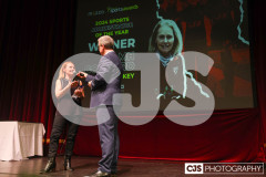 Niamh Goddard (Hockey), Sports Administrator of the Year Winner with host James Davis. Isle of Man Sports Awards 2024. Photo by Callum Staley (CJS Photography)