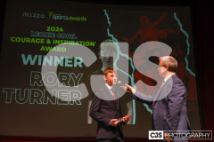 Rory Turner recipient of the Leonie Cooil Courage and Inspiration Award with host James Davis. Isle of Man Sports Awards 2024. Photo by Callum Staley (CJS Photography)