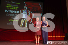 Sarah Corlett presenting Christa Cain (Athletics) with Sarah Corlett Town Planning Consultancy Ltd Veteran Sportsperson of the Year Award. Isle of Man Sports Awards 2024. Photo by Callum Staley (CJS Photography)