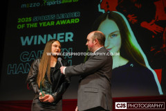 Sure Sports Leader of the Year to Caitlyn Hampson with host Rob Pritchard. Isle of Man Sports Awards 2025. Photo by Callum Staley (CJS Photography)