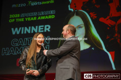 Sure Sports Leader of the Year to Caitlyn Hampson with host Rob Pritchard. Isle of Man Sports Awards 2025. Photo by Callum Staley (CJS Photography)