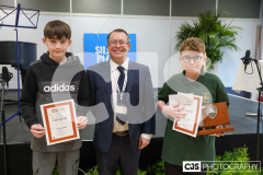 2nd place Tyler Hawley who placed the Baritone Hone, Adjudicator Nicholas Garman & Winner Teddy Price who placed the Bb Cornet. Class B2a Instrumental Solo - Brass (Years 7 & 8). The Manx Music, Speech & Dance Festival 2025. Photo by Callum Staley (CJS Photography)